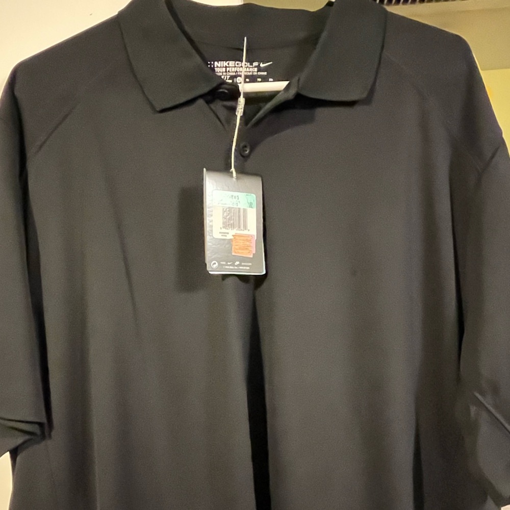 With tags never worn Nike golf shirt